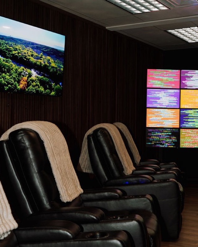 Therapy room with reclining chairs and display screens
